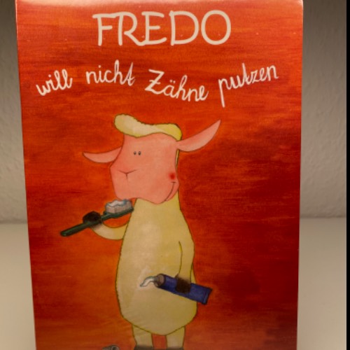 Kinder Buch Fredo Zähne, zu finden beim Stand 40 am Standort Flohkids Berlin Ost