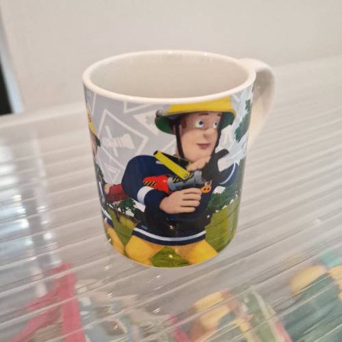 Feuerwehrmann Sam Tasse, zu finden beim Stand 7 am Standort Flohkids Berlin Ost